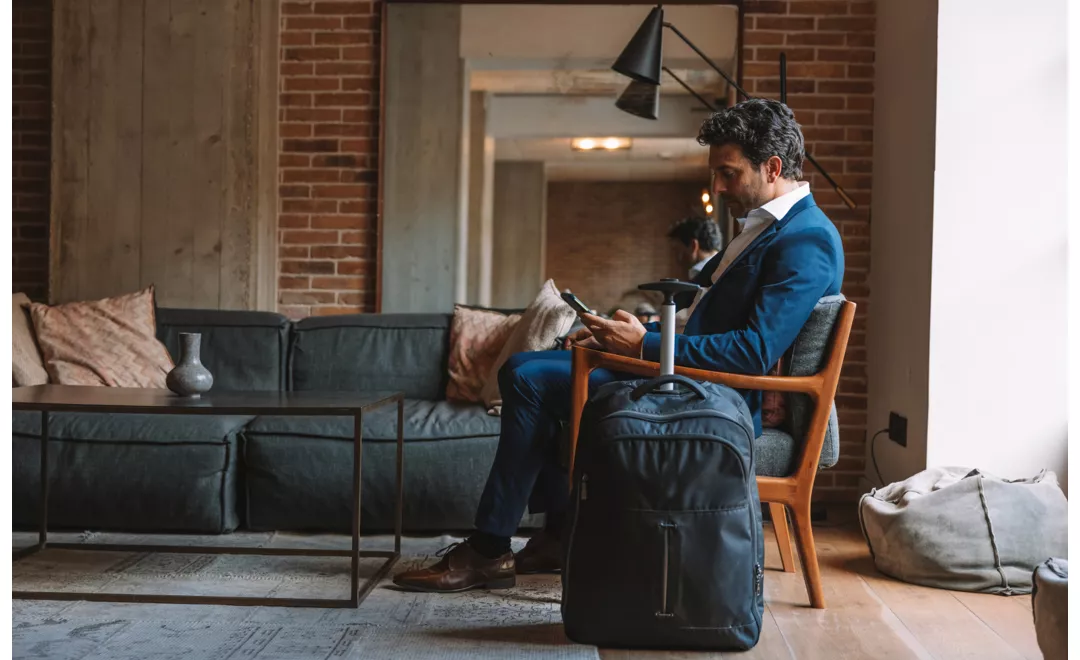 A traveller while reading on the phone