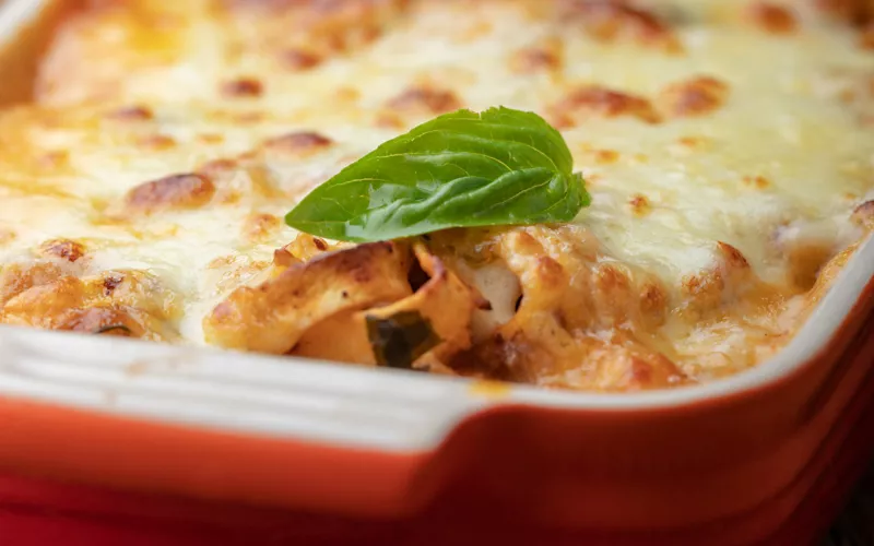 A pan of lasagne with ragu sauce