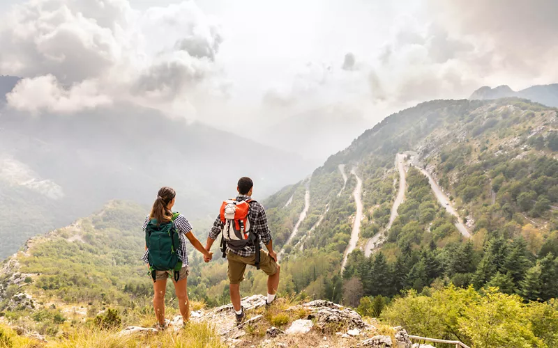 Woman hiker on summer hiking in Tuscany enjoying promenade Stock Photo by  ©CITAlliance 250109576