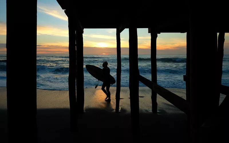 Surfing at sunset