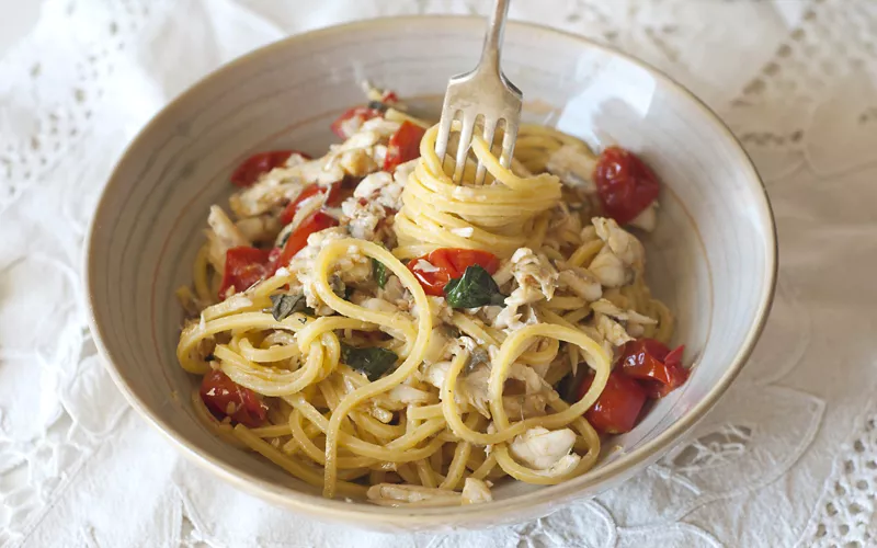 A dish of spaghetti with fish sauce