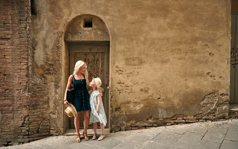 Woman with a child in a village