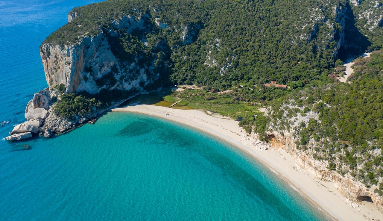 AERIAL VIEW OF THE FAMOUS AND BEAUTIFUL CALA LUNA BEACH IN SARDINIA