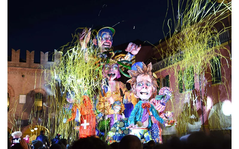 An allegorical float parades along a street in Cento, Emilia Romagna