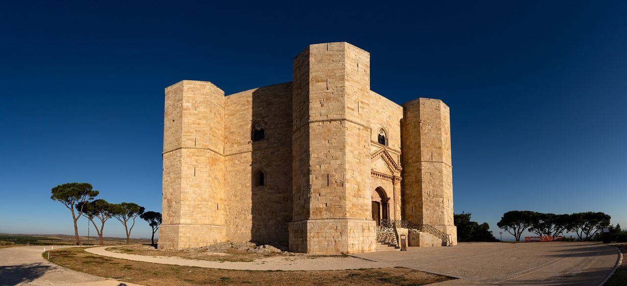 Panoramic view of Castel del Monte, the famous castle built in an octagonal shape by the Holy Roman Emperor Frederick II in the 13th century in Apulia, Italy. World Heritage Site since 1996.
