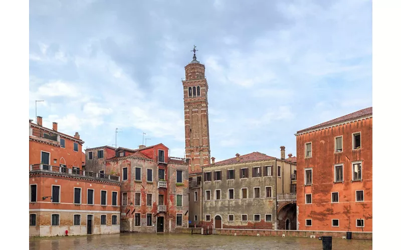 The leaning skyline of Venice and its bell towers.