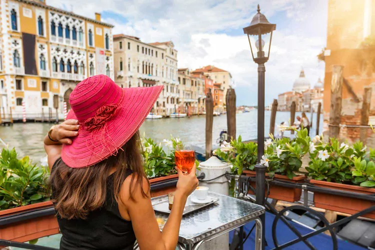 An aperitif overlooking the Basilica of San Marco or on a terrace overlooking the Grand Canal