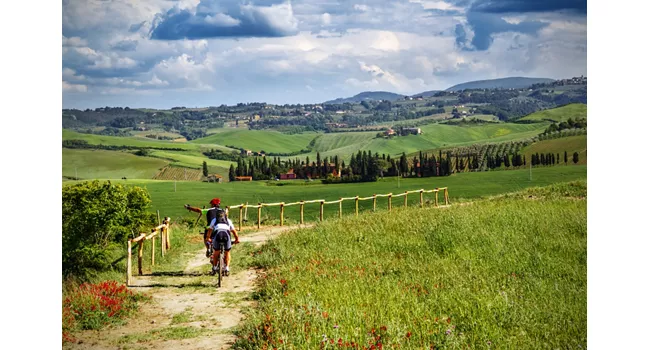 Mountain bikers on touristic trail in Tuscany 