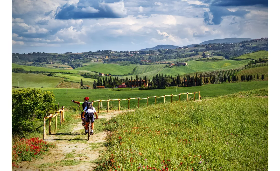 Mountain bikers on touristic trail in Tuscany 