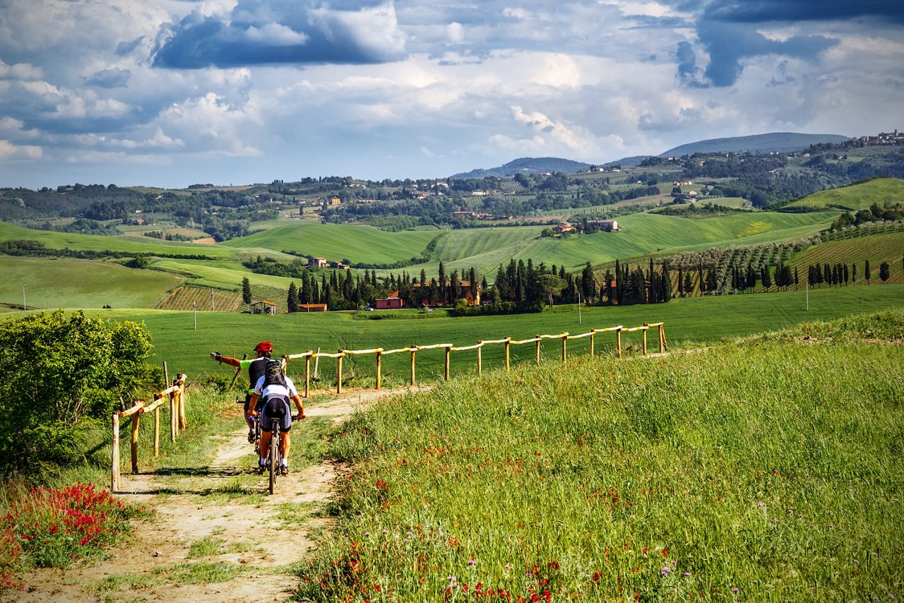 Mountain bikers on touristic trail in Tuscany (Italy)