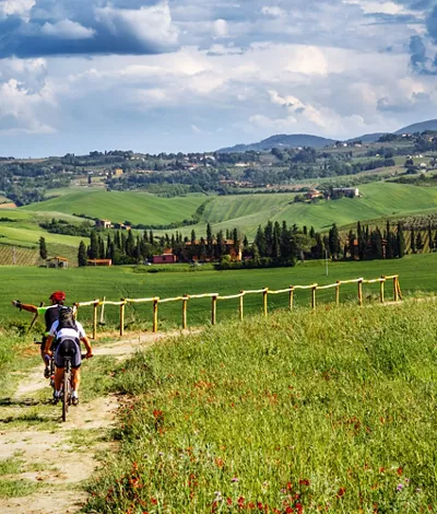 Mountain bikers on touristic trail in Tuscany 