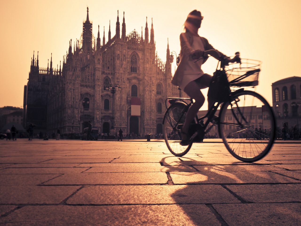 Woman cycling in Milan