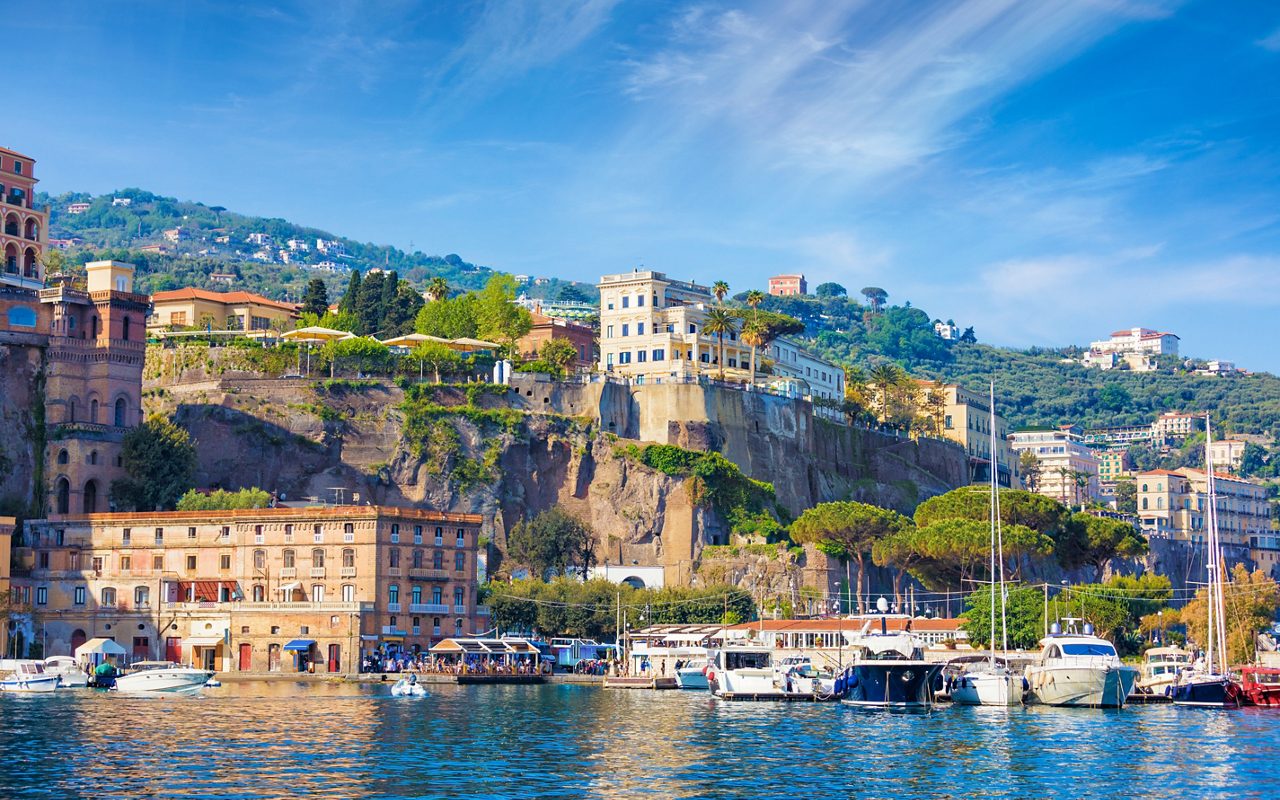 View from sea coastline of Sorrento and Gulf of Naples, Italy. Sea cliffs and luxury hotels of Sorrento attract lot of tourists from all over world.  