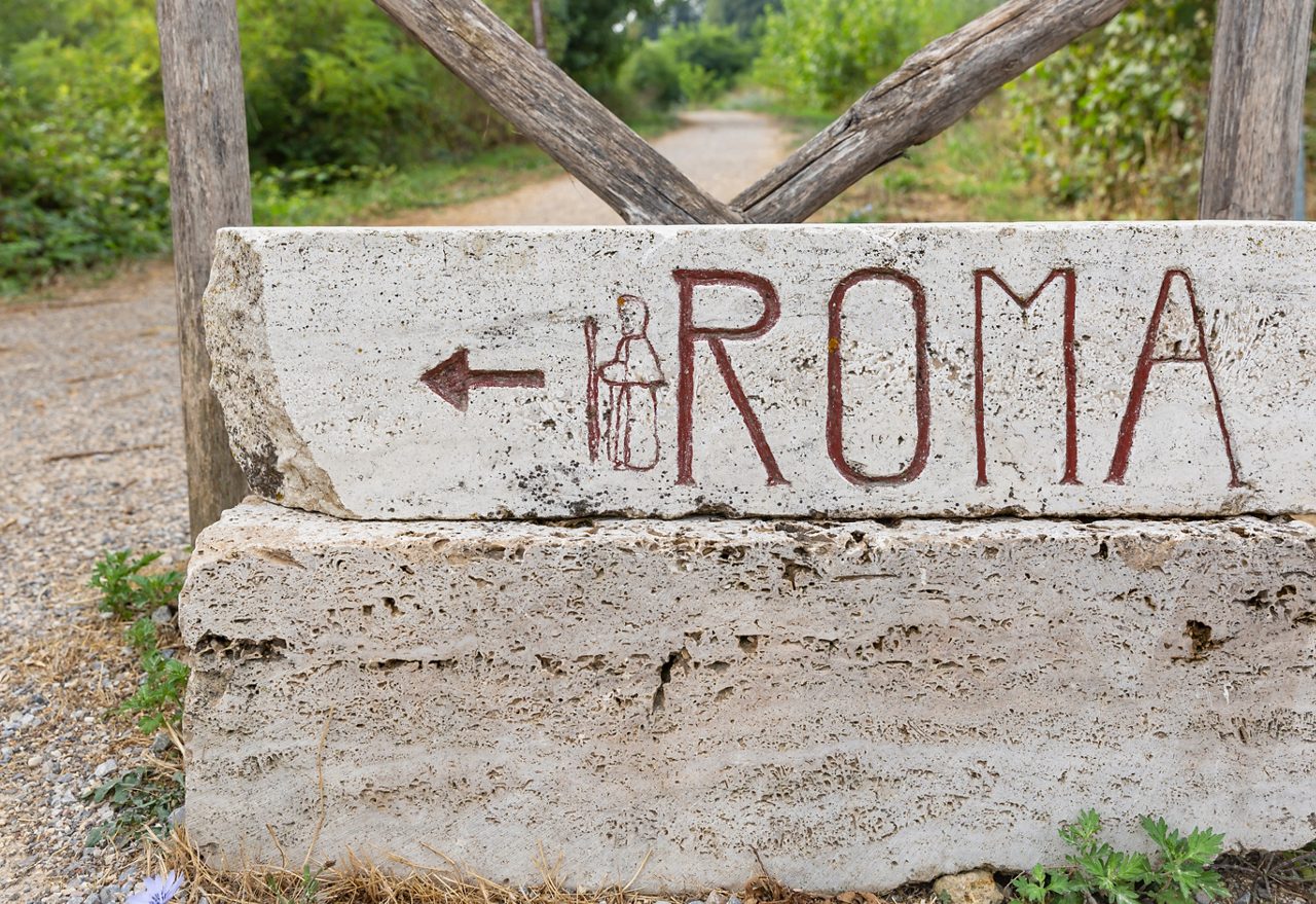 Via Francigena (pilgrim's route to Rome) way marker showing the direction to Rome