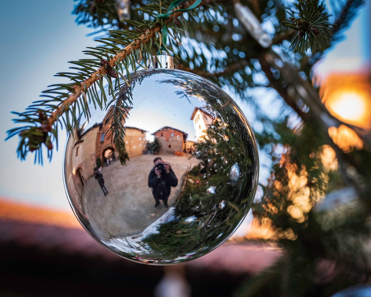 Ricetto of Candelo, Biella, Piedmont, Italy: Medieval village reflected in a Christmas ball 