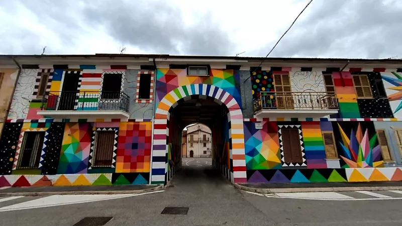 A building with a large, colourful abstract mural in Aielli, Abruzzo