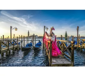 Venice Carnival mask on the canal