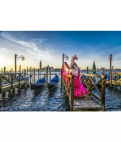 Venice Carnival mask on the canal