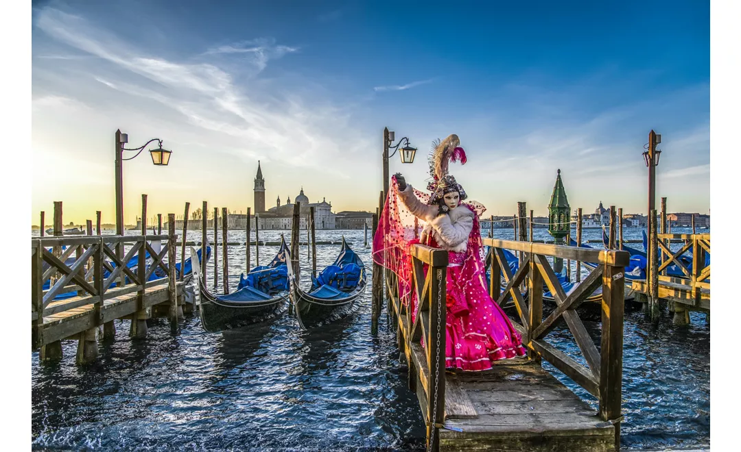 Venice Carnival mask on the canal