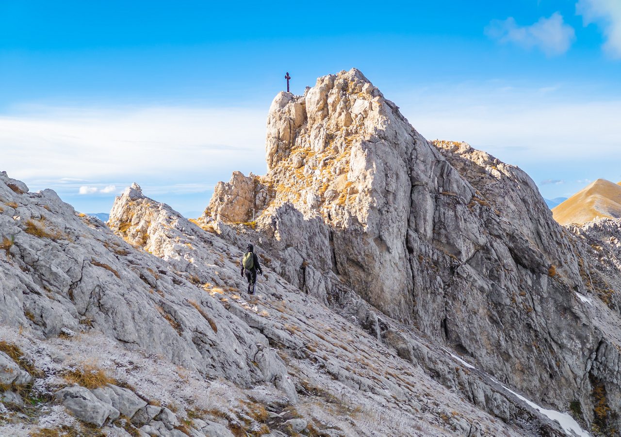 Gran Sasso, Italy - 14 November 2021 - The mountain summit of central Italy, Abruzzo region, with hikers who practice trekking at high altitude. Here with Pizzo Cefalone and Cima Giovanni Paolo II 