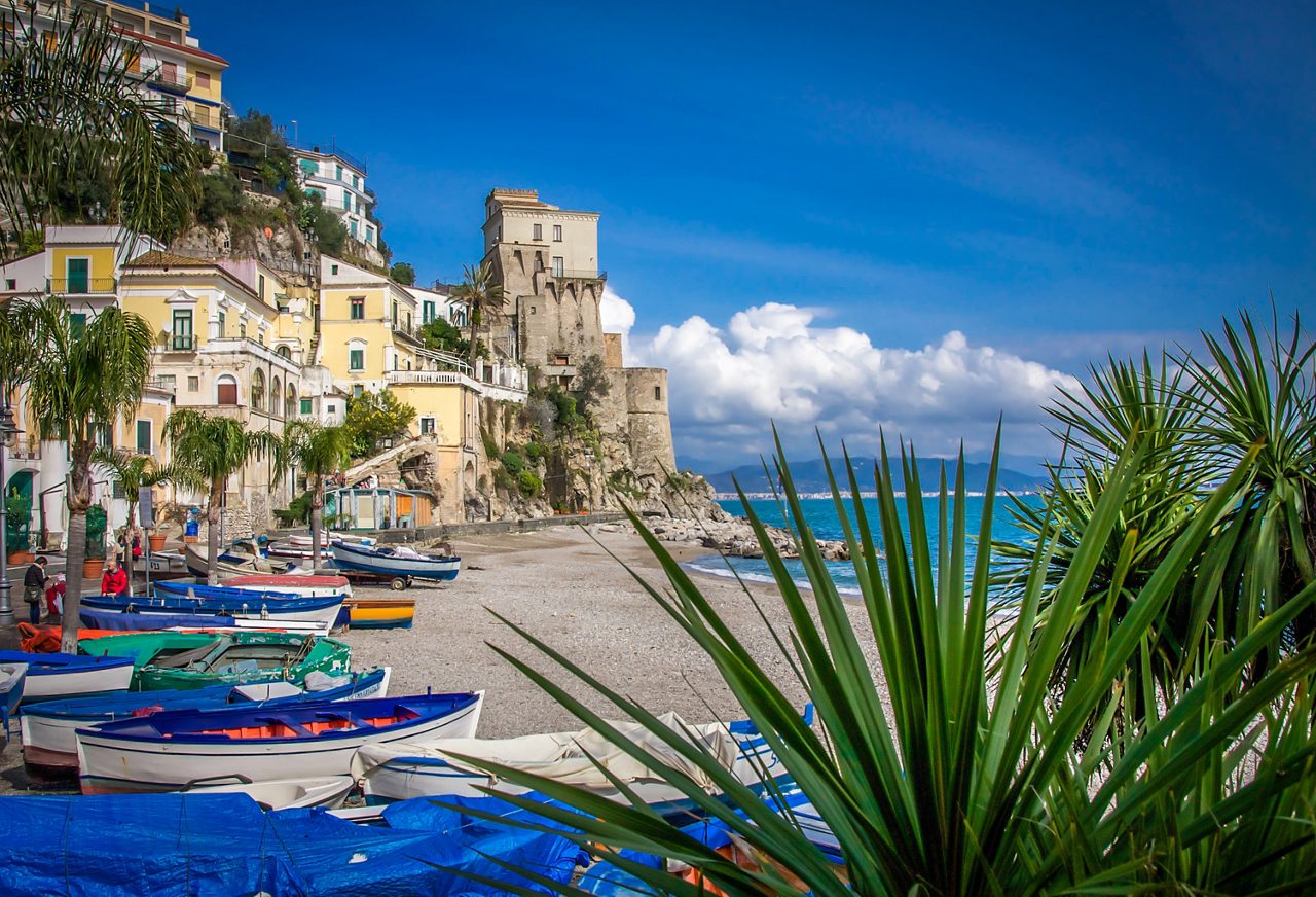 Sandy beach cove with colorful boats on Amalfi Coast, Cetara