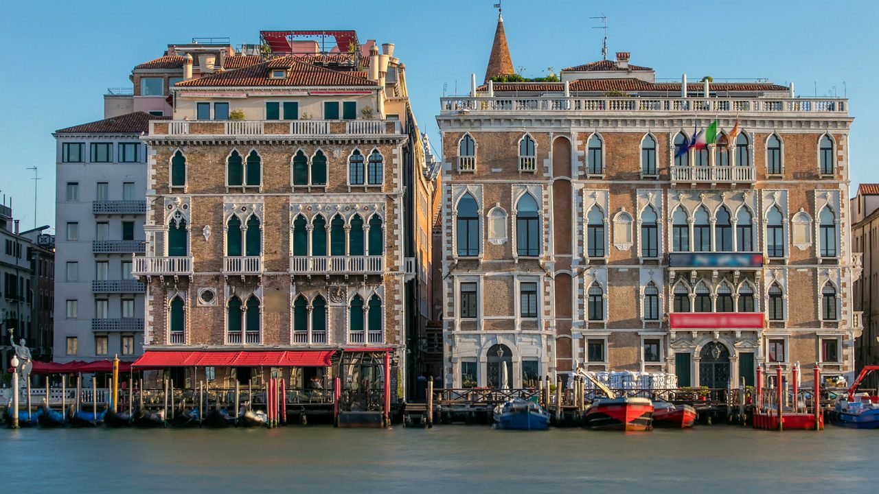 Palazzo Giustinian on the Grand Canal timelapse, Venice, Italy. Early morning after sunrise. Gondolas staying near by