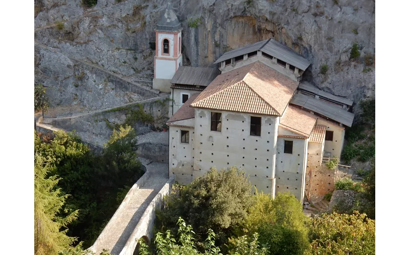 Aerial view of the Sanctuary of the Madonna del Pollino, built close to a majestic rock face