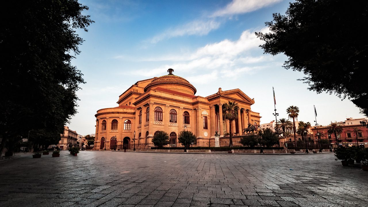 Teatro Massimo, Opera House, lit by the morning sun. Blue sky and little clouds. Famous theater architecture in Palermo, Sicily in Europe. Important Landmark and Tourist Spot. Instagram Style filter