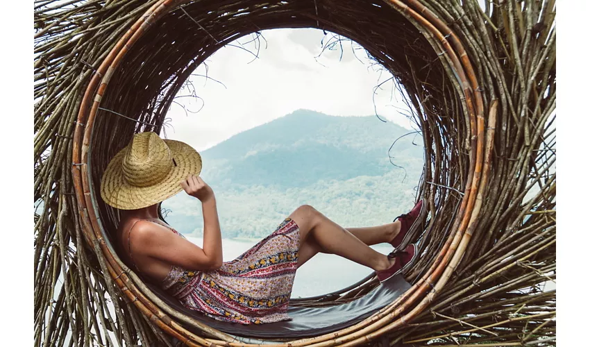 Traveller young woman sitting looking the mountain landscape at world trip