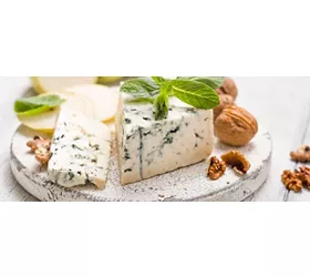 Segment of blue mould cheese - Gorgonzola with pear and walnuts on wooden board.  Top view
