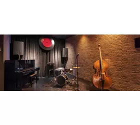 Modern jazz bar interior design, stage with black piano and cello