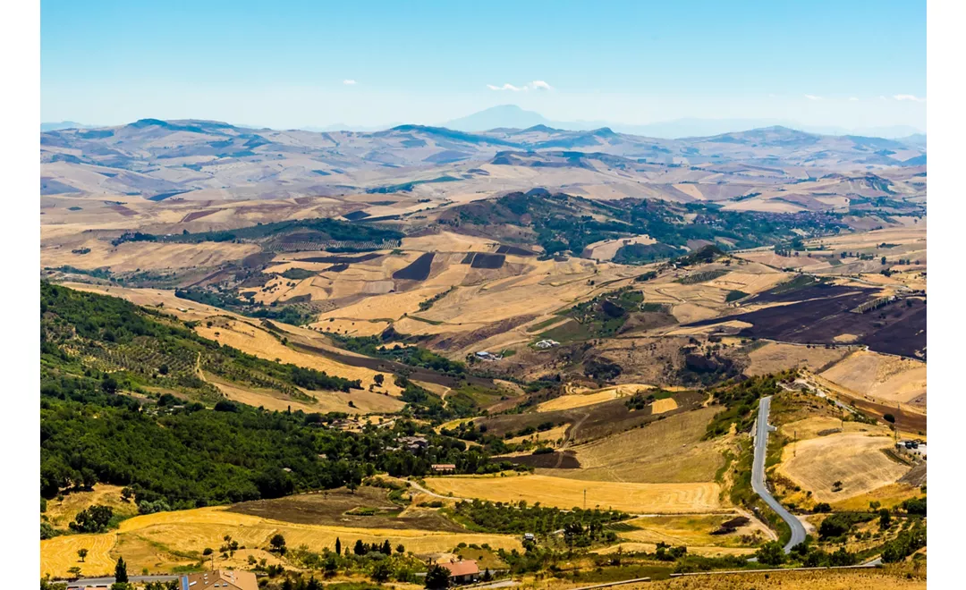 The Madonie Mountains, Sicily stretching out to Mount Etna in the far distance, viewed from Petralia Soprana during summer