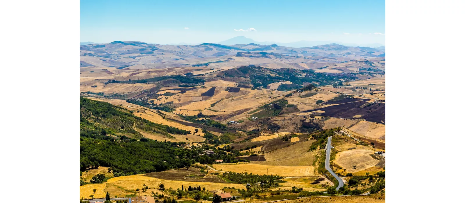 The Madonie Mountains, Sicily stretching out to Mount Etna in the far distance, viewed from Petralia Soprana during summer